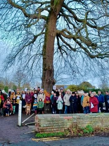 A group of people by the King George Oak in Wivenhoe. Image by Newsquest.